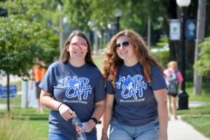 Two college students smiling