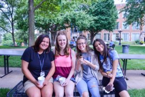 Four Students sitting on a bench