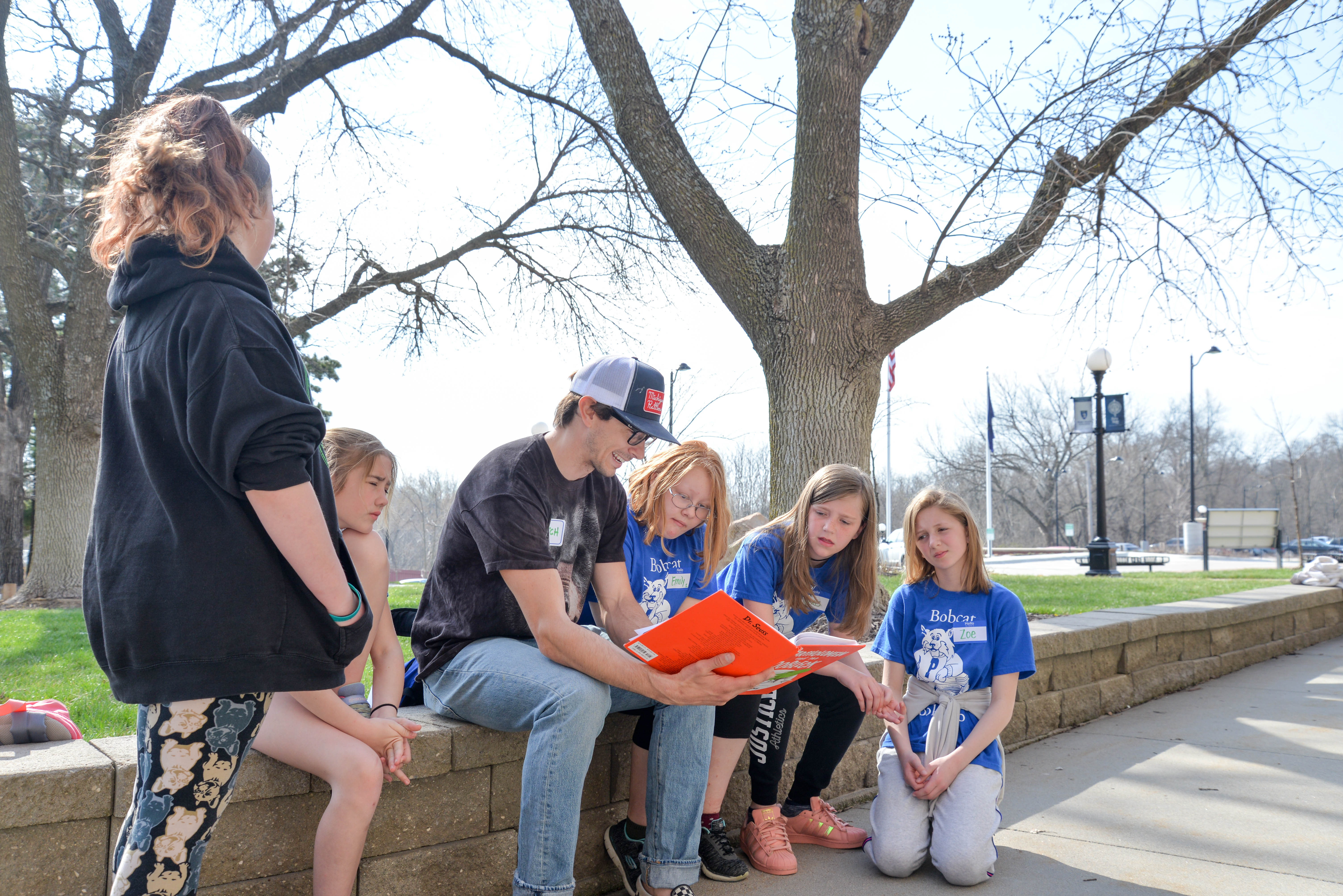 students on a wall