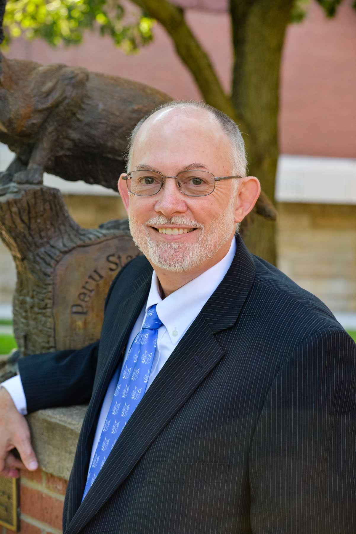 Michael Evans in front of the Bobcat statue