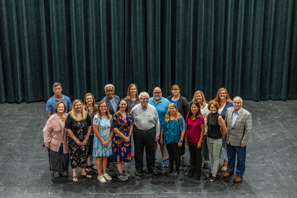 A group photo of the Education faculty and staff taken in the doorway of the TJ Majors building