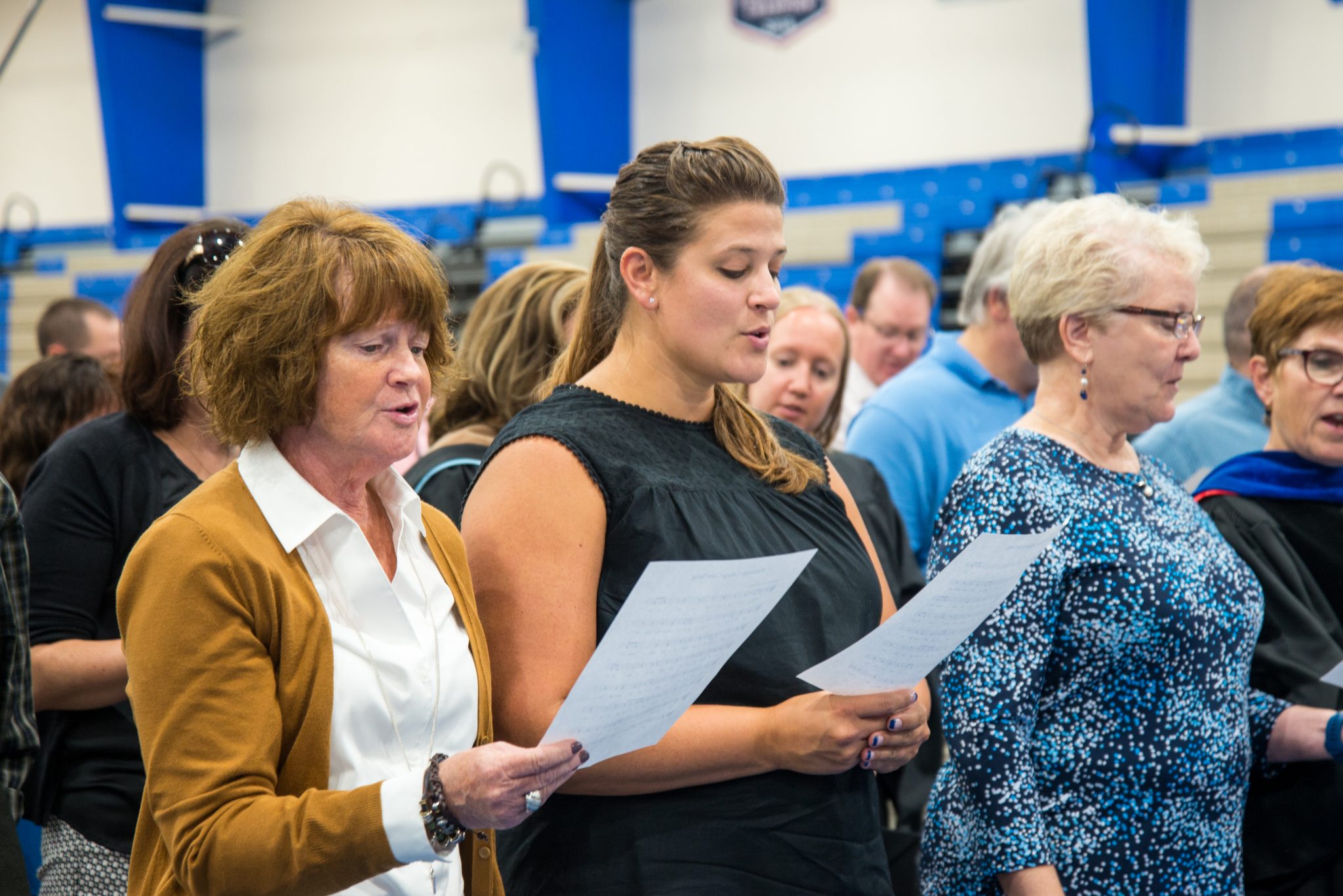 Faculty singing the color song