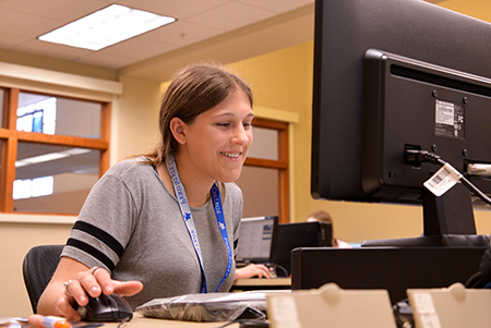 Student at a computer in the CATS building
