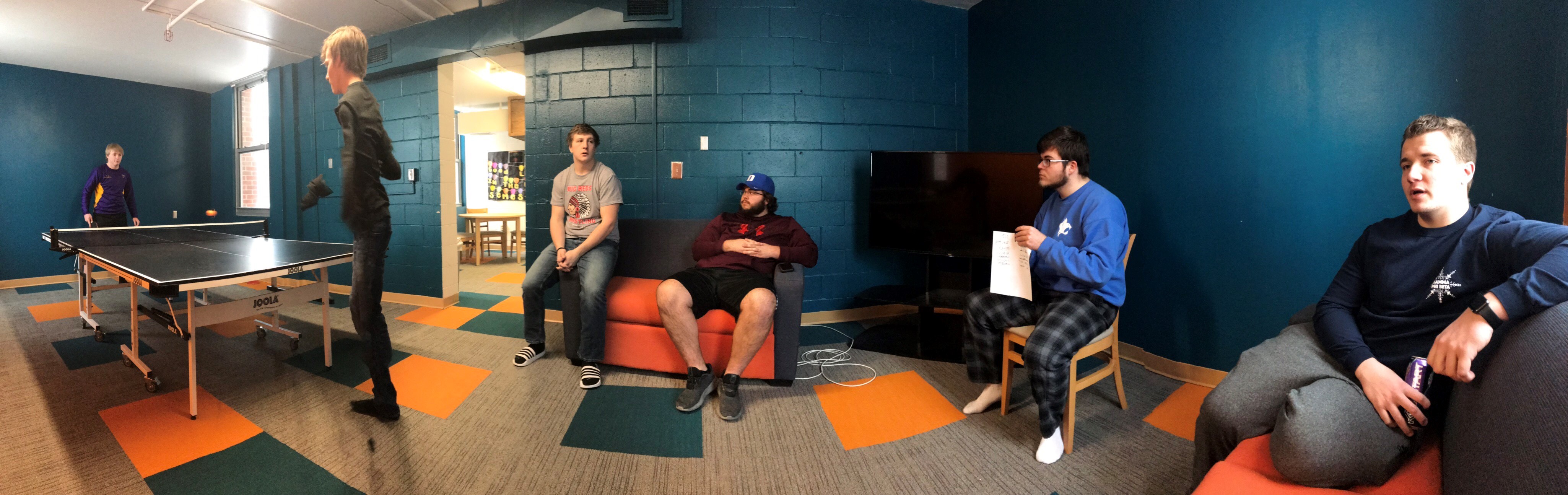 Students playing pingpong and chatting