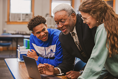 Dr. Ingram meeting with 2 students.