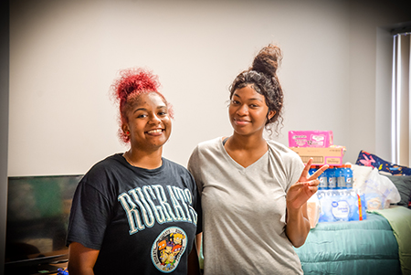 2 students in a dorm room.